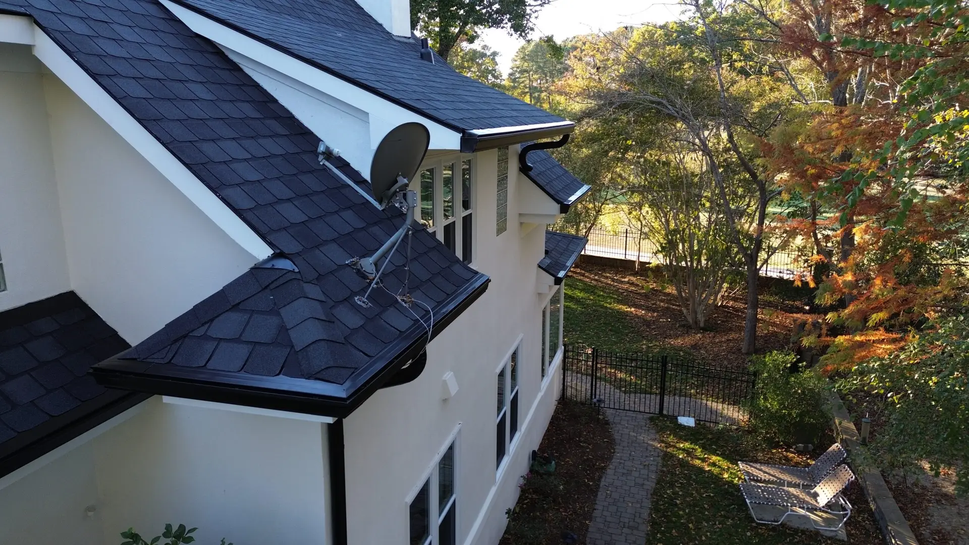 Black 6 inch Gutters and E-Z Solid Gutter Guards installed by KwK